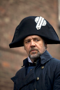 Inspector Javier (Russell Crowe), wearing almost the identical garb of the former (and now fallen) Emperor Napoleon Bonaparte I, on the lookout for Jean Valjean.