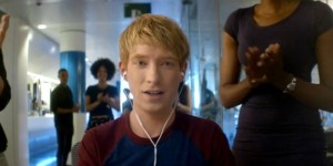 Caleb (Domhnall Gleeson) finding out at work, to his delight, that he has won the competition to be part of a break-through experiment.