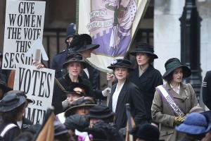 Maud at a demonstration for women's right to vote with Violet Miller (Anne-Marie Duff, left) and Edith Ellyn (Helena Bonham Carter, right).